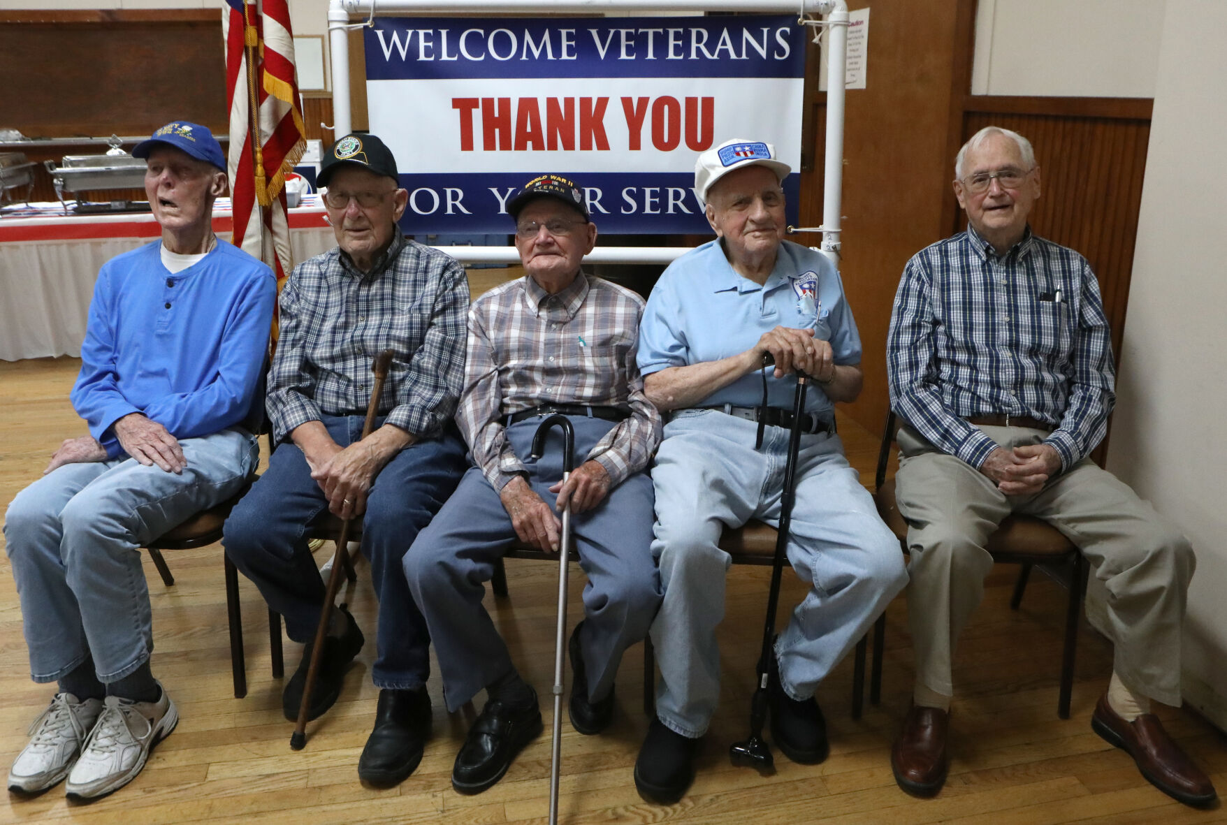 World War II Veterans sit for a portrait